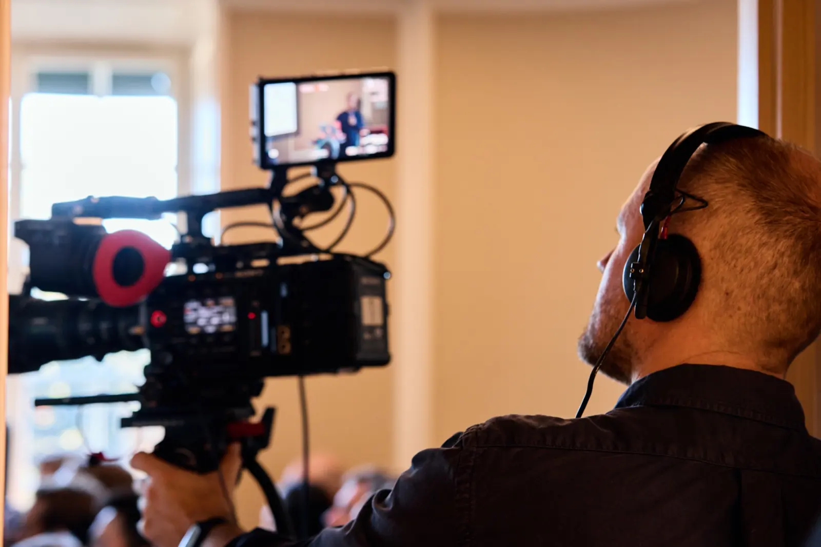 Camera operator filming the talk at Proxify